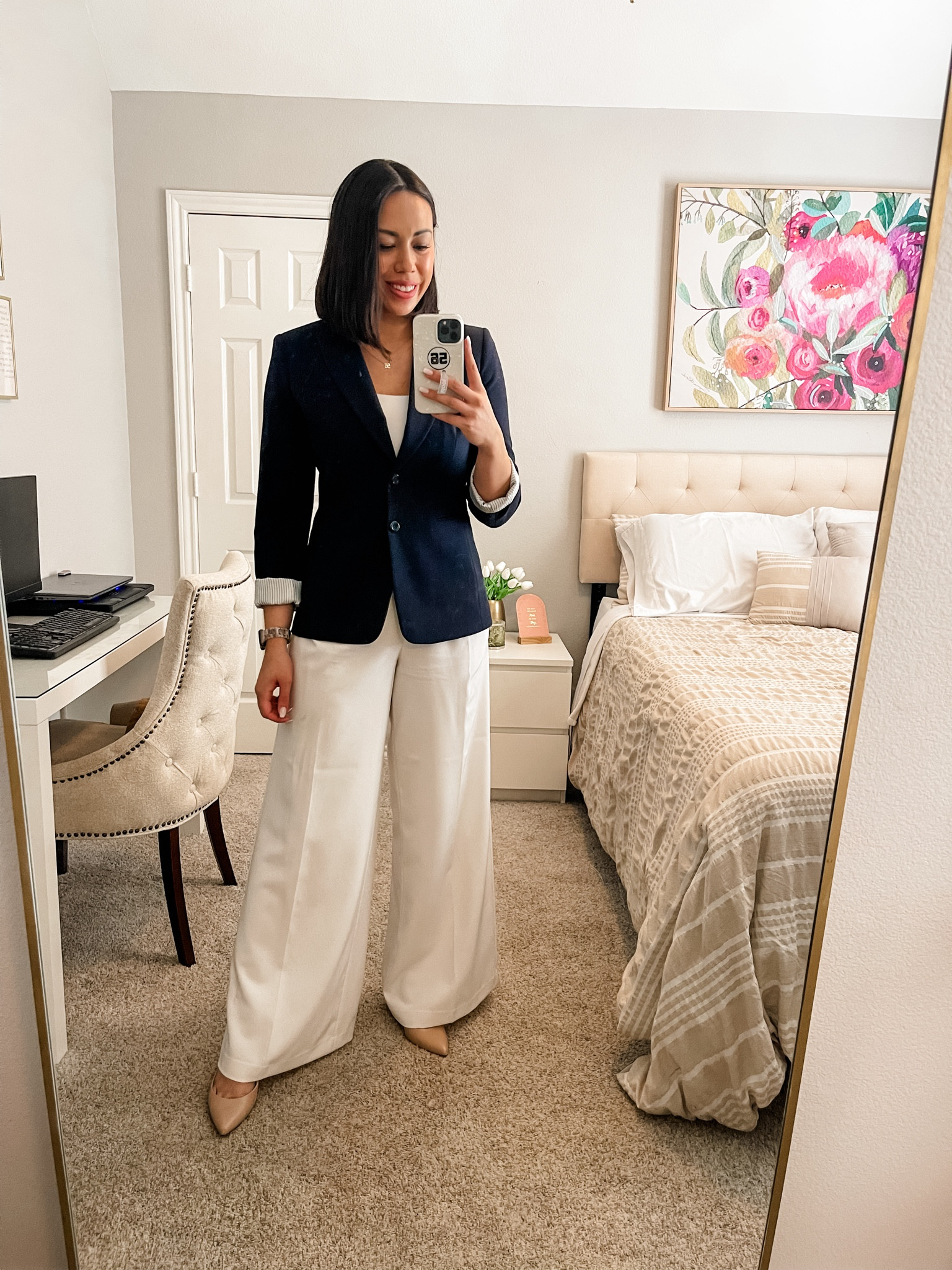 I love pairing this navy blazer with an all white base for a crisp spring workwear look!

- Navy Blazer: Size 6
- Scoop Neck Bodysuit: Size Medium 
- White Wide Leg Pants: Size 4
- Nude Pumps: Size 8

#LTKSeasonal #LTKworkwear #LTKstyletip