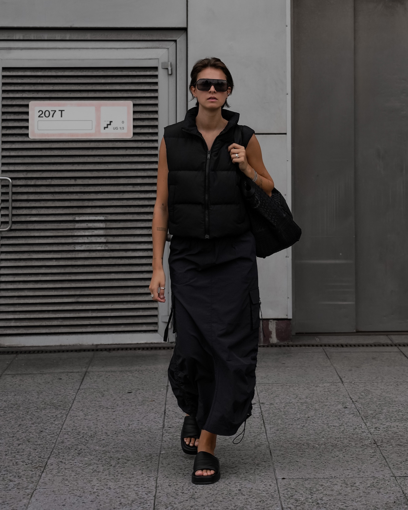 All black outfit for the transitional season. Wearing a sporty skirt and puffer vest.

#LTKeurope #LTKstyletip