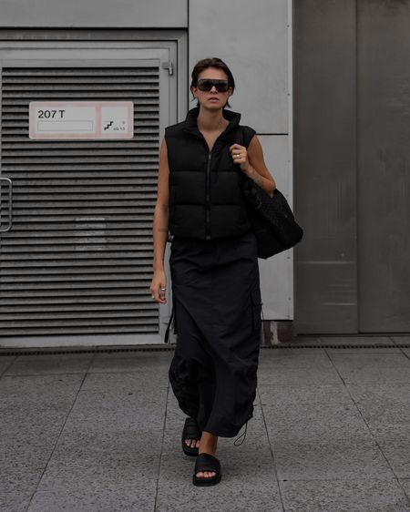 All black outfit for the transitional season. Wearing a sporty skirt and puffer vest.

#LTKeurope #LTKstyletip