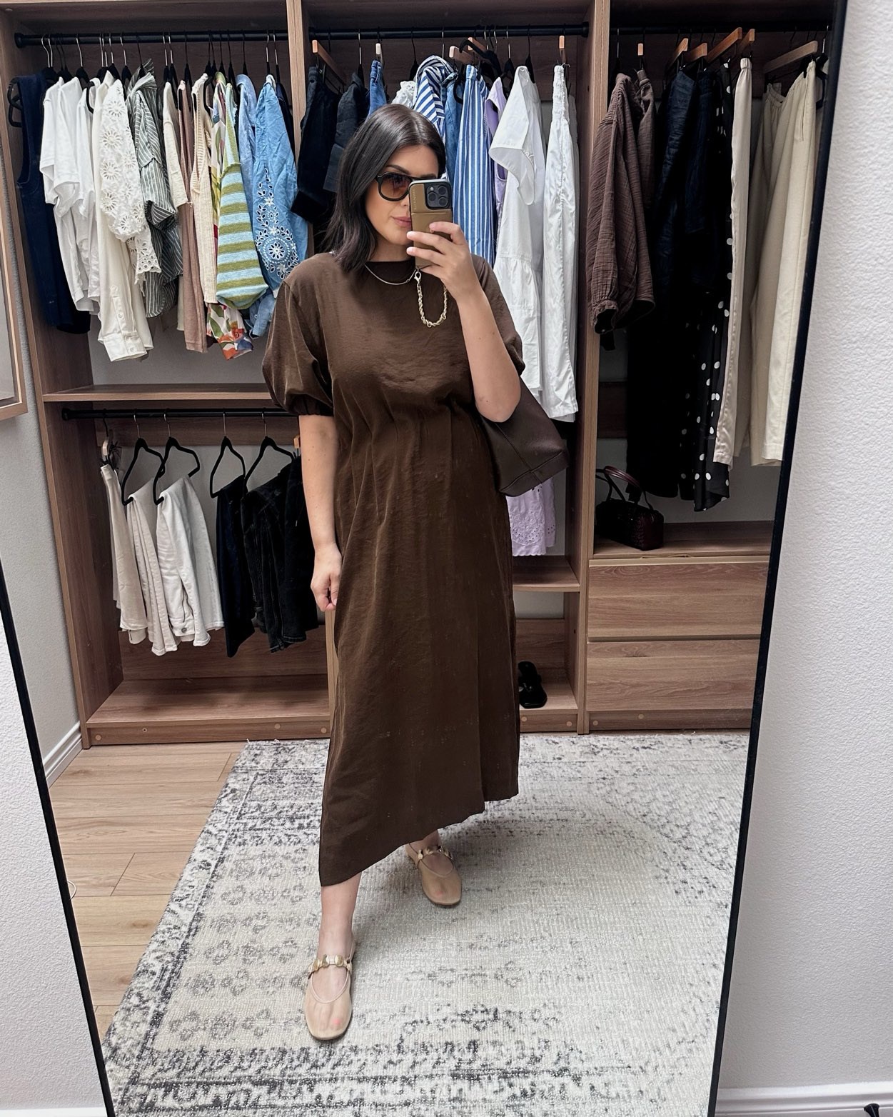 I'm in the large of the maxi dress -- fit is perfect for me! The middle part comes in, it's ruched / cinched and it's very flattering for those with a rounder waist. 

 