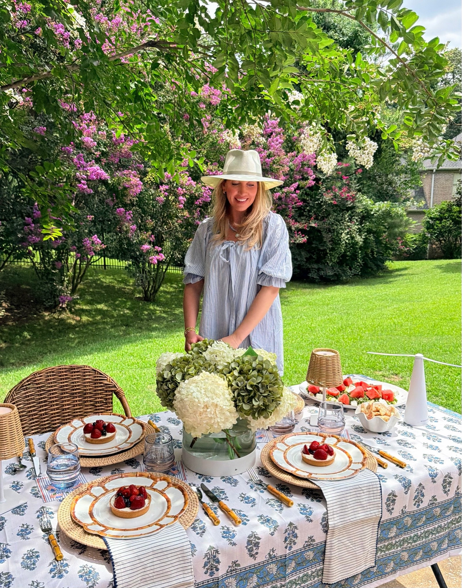 Summer tablescape! Melamine plates, bamboo flatware (budget friendly), blockprint tablecloth, cotton dress, packable hat, the BEST rechargeable lamps and more fun pieces I love!!