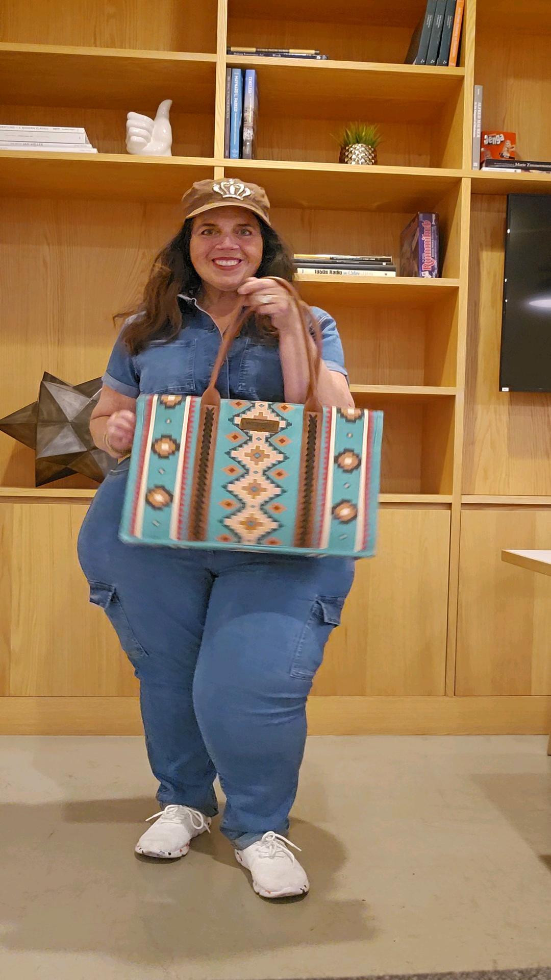 Cargo pocket denim jumpsuit is SO comfortable. Practical one piece dressing in this boilersuit! (Wearing XL for reference) Cognac Belt to pull the look together.Wrangler tote bag adds a southwest / country vibe.

#LTKFallSale #LTKMidsize #LTKItBag