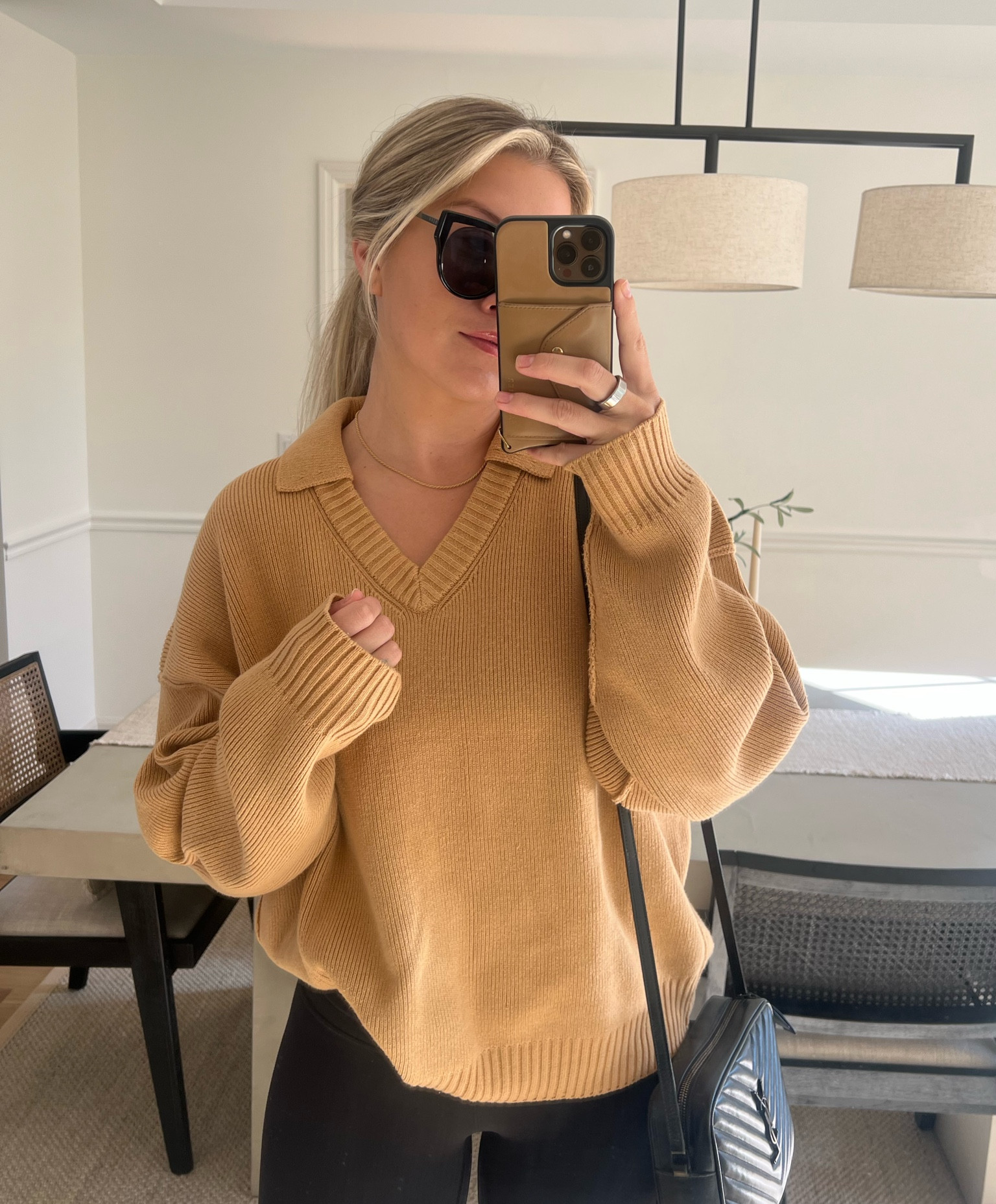 Living in this seater - wearing a size large but could have sized down 