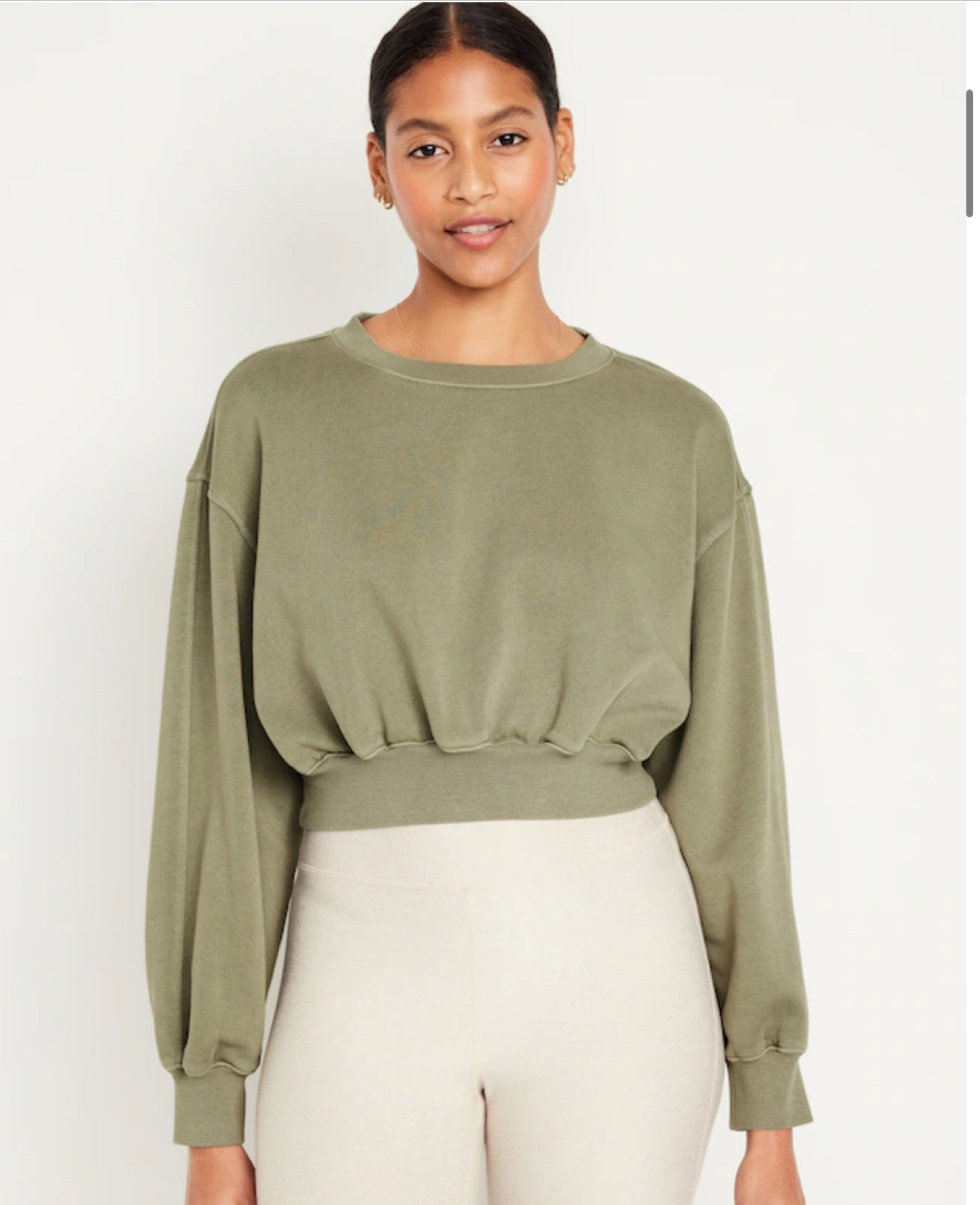 Wearing a medium in sweatshirt and 
Size small and extra small in tank