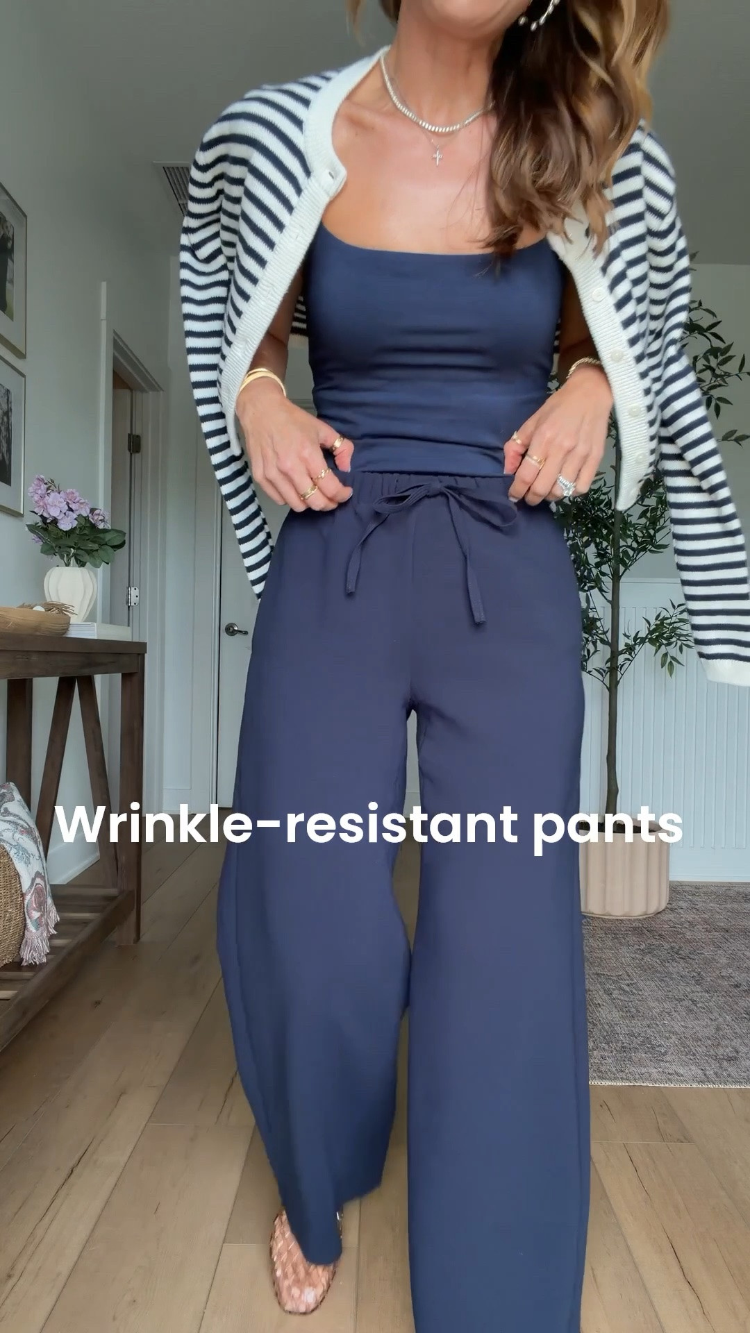 My summer outfit of the day! Elevated casual outfit. Mom outfit. Europe outfit. Business casual. Travel outfit. Aritzia wrinkle resistant wide leg pants in XS short. Aritzia striped cardigan in 2XS. Amazon cami in XS. Jelly ballet flats are whole sizes only - I sized down to a 6 per reviews and am usually a 6.5.

#LTKgrwm #LTKootd #LTKTravel