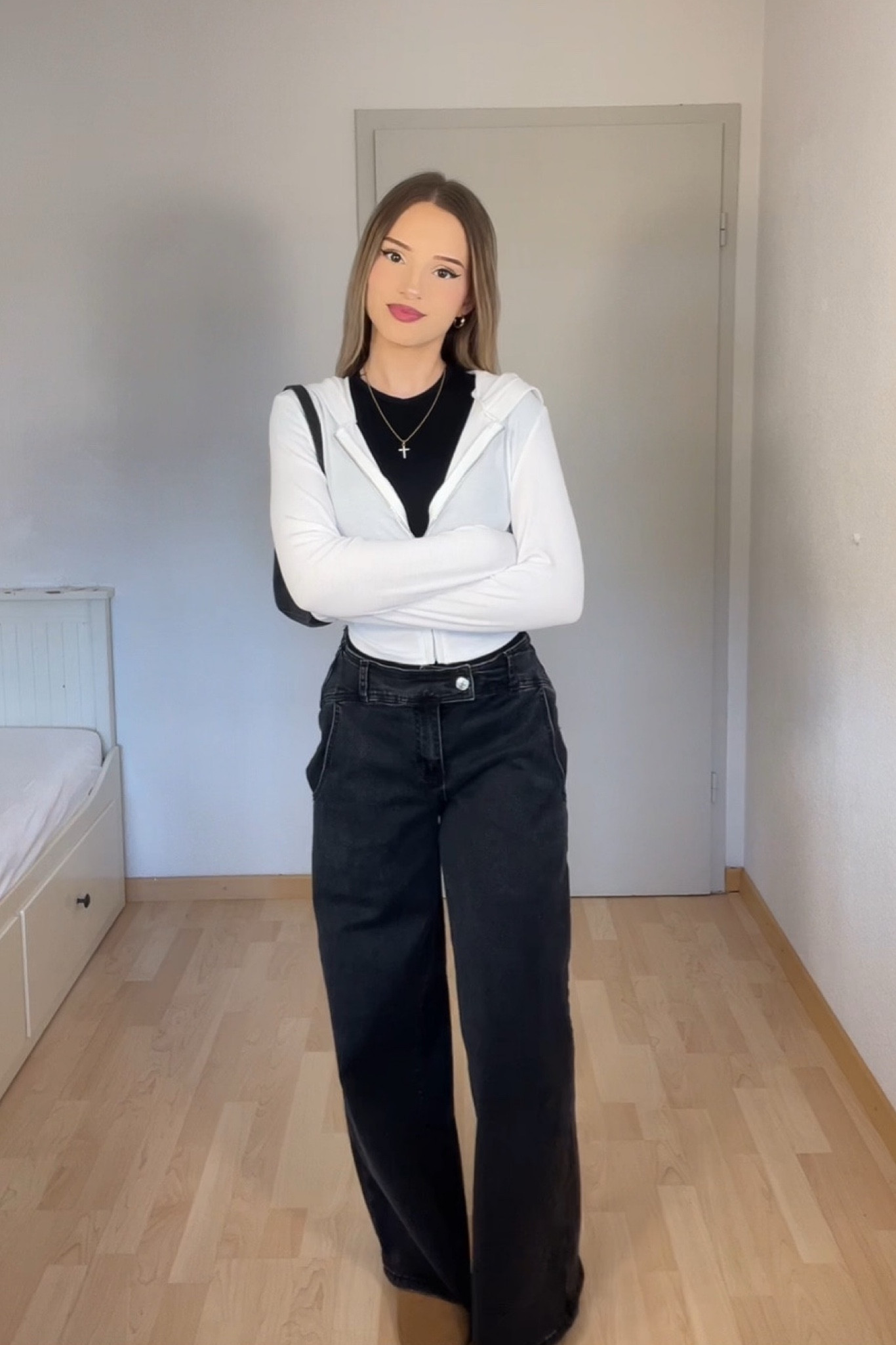 Casual and cool outfit featuring wide-leg black jeans paired with a fitted black top layered under a white zip-up hoodie for a relaxed, sporty vibe. Styled with a black crossbody bag and minimal accessories for a sleek, monochrome contrast. Perfect for an effortless everyday look.

#CasualStyle #StreetwearVibes #RelaxedFashion #WideLegJeans #MinimalStyle #SportyChic #EffortlessOutfit #NeutralOutfits #MonochromeLook #LTKStylist #LTKCasual #LTKStreetStyle #LTKMinimal