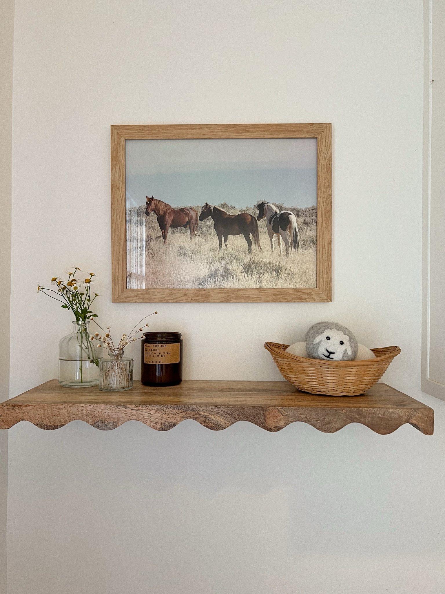 Beautiful wild horses print. The shelf is from World Market, the basket thrifted, bud vases from Target, dryer balls from Marshall’s. 

#LTKhome #LTKfindsunder50 #LTKGiftGuide
