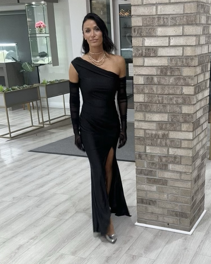 “Elevated elegance for an evening to remember ✨ Dressed in a sleek one-shoulder black fitted dress with a sultry slit, paired with sheer long black gloves for that timeless formal touch. Completed the look with metallic silver heels to add a modern shine to the classic silhouette.

Perfect for a gala under the stars 🌌 Shop this look now on my LTK! #EveningGlam #TimelessElegance #LTKFormalStyle #BlackTieChic”

#LTKShoeCrush #LTKHoliday #LTKParties