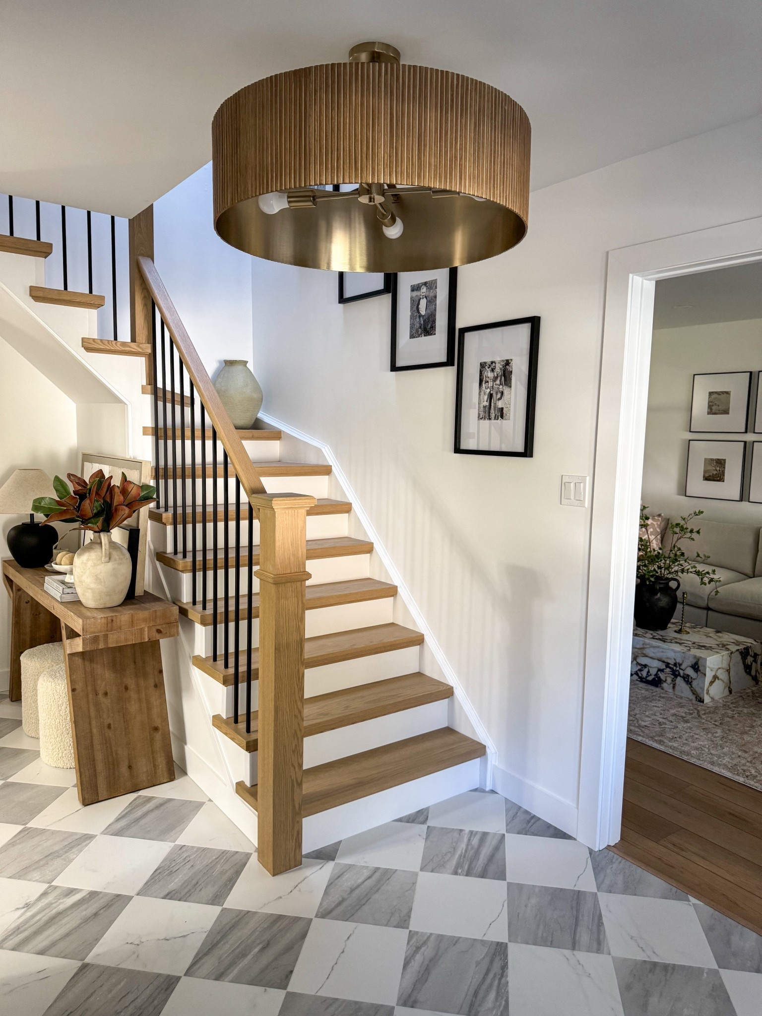 Foyer finds🤎

#console table #chandelier #frames #coffeetable 

#LTKHome