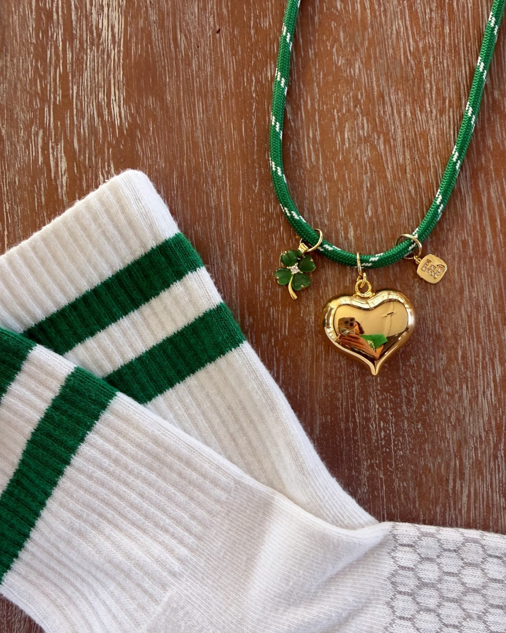 Showing off my EMERALD GREEN school spirit with sone fun accessories today. I custom made the cord necklace and the green sicks will keep me cozy & warm today. 

#LTKActive #LTKmomlife #LTKootd