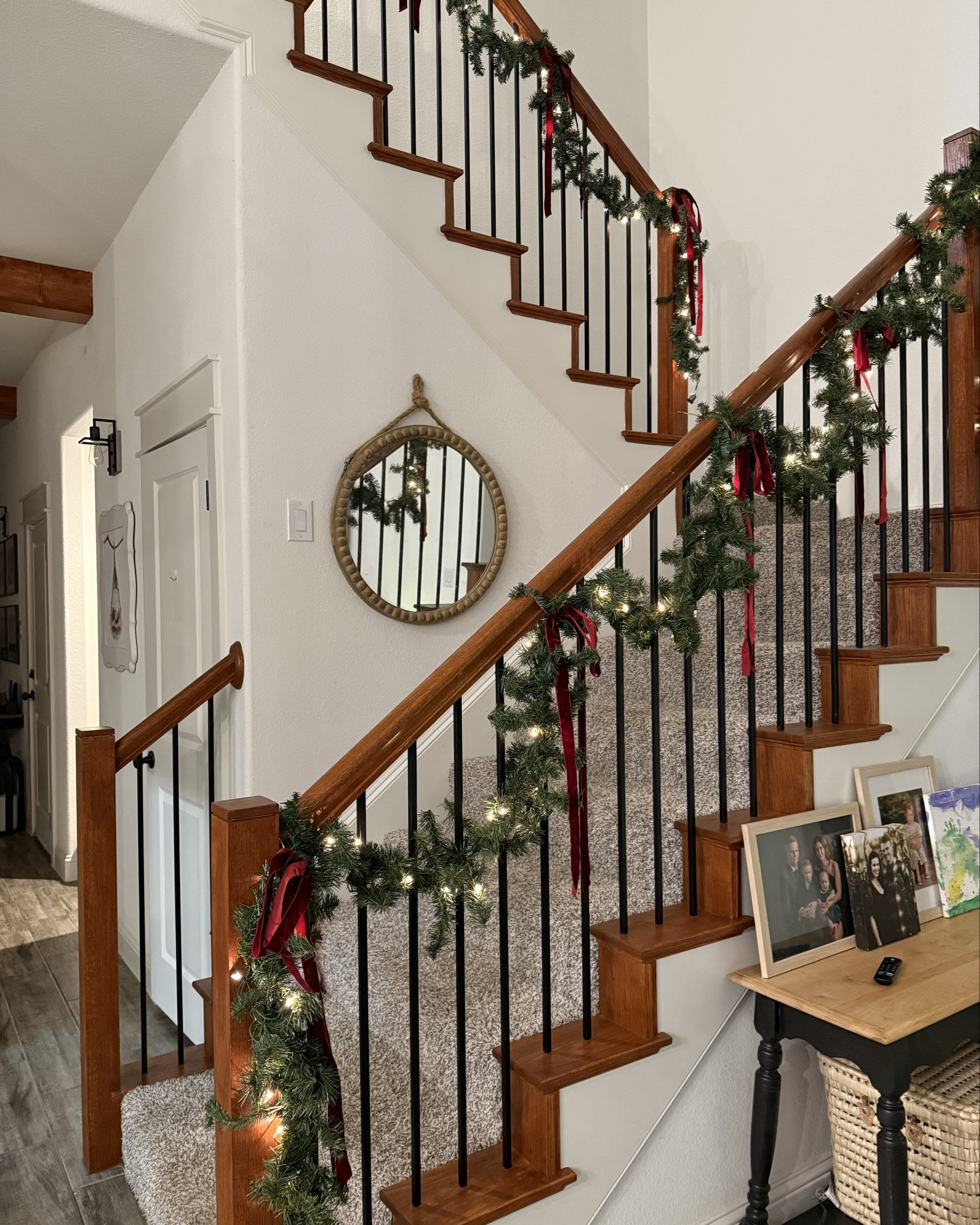 Staircase garland on a major budget! 2 pieces of 9 foot pre-lit garland from Home Depot & some Amazon Christmas bows for a super simple, elegant look on a BUDGET. 
 I’ve had this garland for 3 years and thought I was tempted to switch it to the “real look” stuff. I decided against it for the time being! 
#garland 
#christmasgarland 


#LTKHoliday #LTKHome #LTKSeasonal