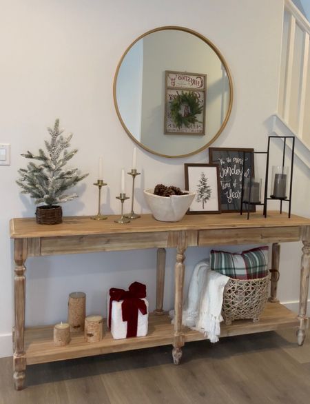 Entryway console table - linked my console table from World Market! My mirror, candle holders, basket with blanket, flameless candles and more are linked! 

#LTKHoliday #LTKhome