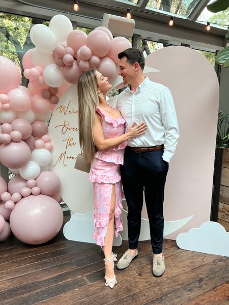 Perfect baby shower or brunch outfit for spring - pink floral midi dress with bow pearl pumps. Dress runs small - wearing a small but should have ordered a medium. He is in comfortable slacks with stretch and performance fabric button up shirt. Use code sarahrose15 for 15% off of your online or in store Mizzen + Main purchase through April 16 