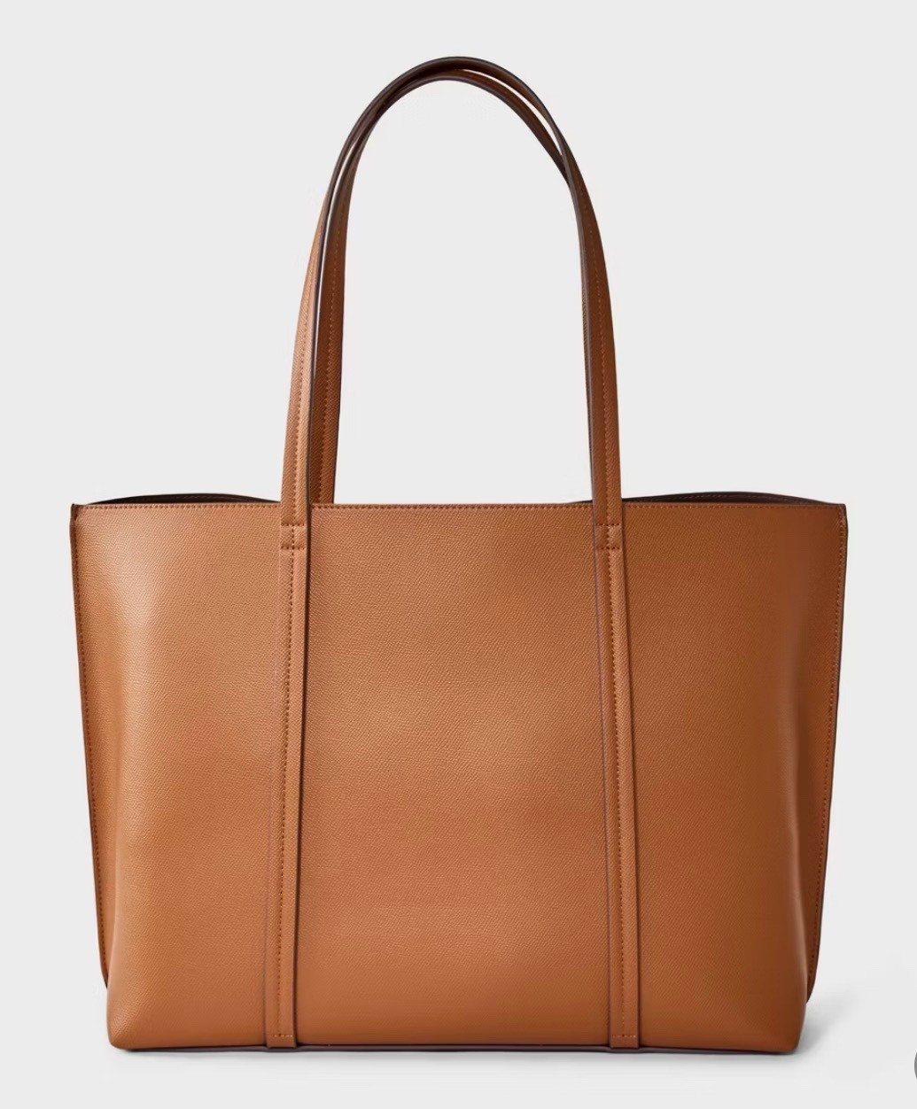 An affordable everyday tote that fits everything — perfect for errands, work, or daily essentials. Simple, structured, and easy to style with neutral outfits.


#LTKTravel #LTKWorkwear #LTKSaleAlert