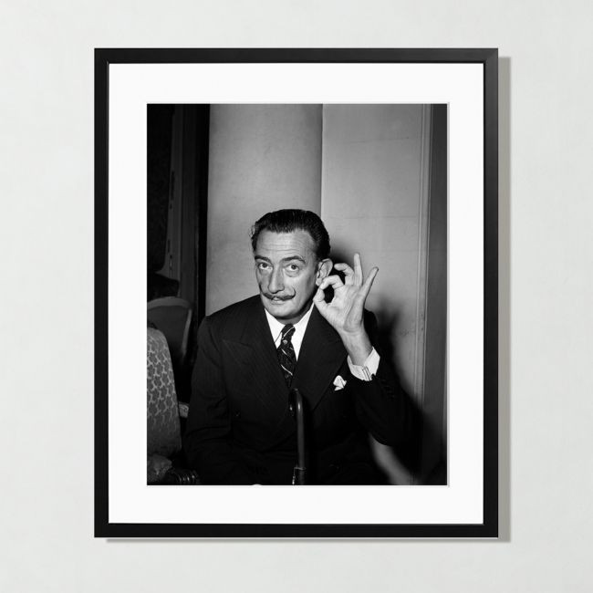 black and white photograph of Salvador Dali in a black frame