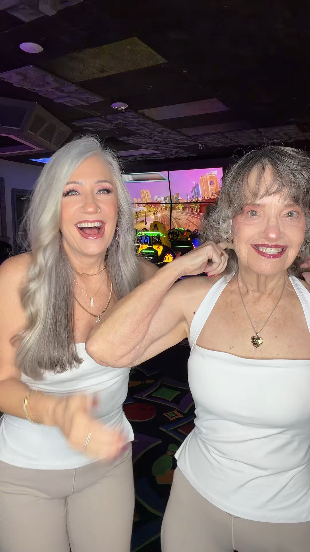 Arcade twinning! 🤍🤎 Our flared leggings and white halter tops are so flattering on both of us!#momdaughter #twinning #flarepants #haltertop #springfashion 

#LTKdayinmylife #LTKootd #LTKmomlife