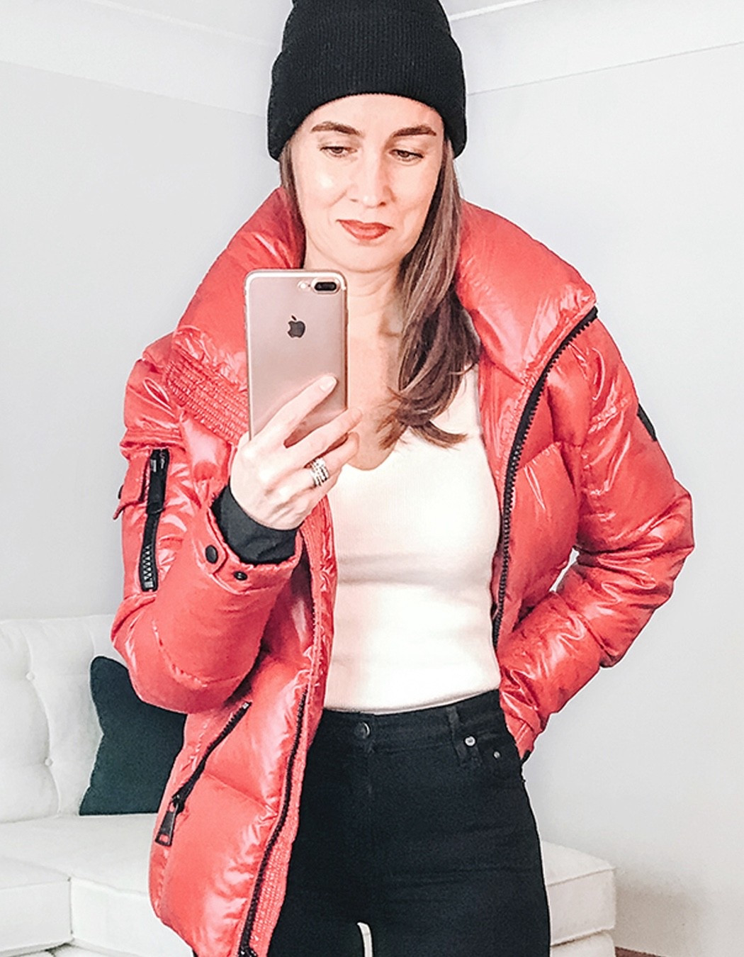 My red puffer jacket is on sale. Ski jacket. SAM. puffer jacket. White v-neck sweater. Winter knit beanie hat.  #skijacket #pufferjacket #winterjacket #wintercoat #over40style #skivacation #skiweekend

#LTKootd #LTKSaleAlert #LTKOver40
