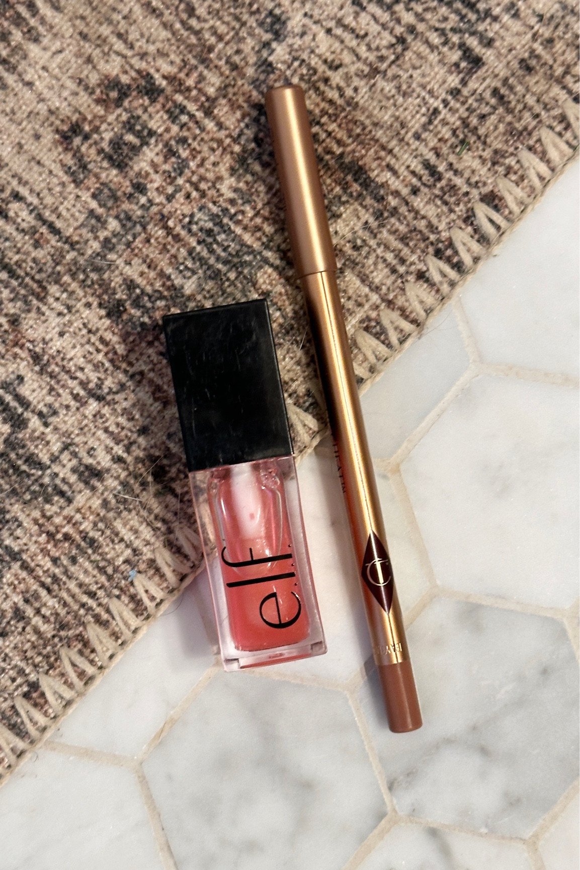 Latest lip combo. Wearing iconic nude lip liner from Charlotte Tilbury and pink quartz lip oil from ELF. 

 

#LTKxelfCosmetics 

#LTKBeauty #LTKItBag