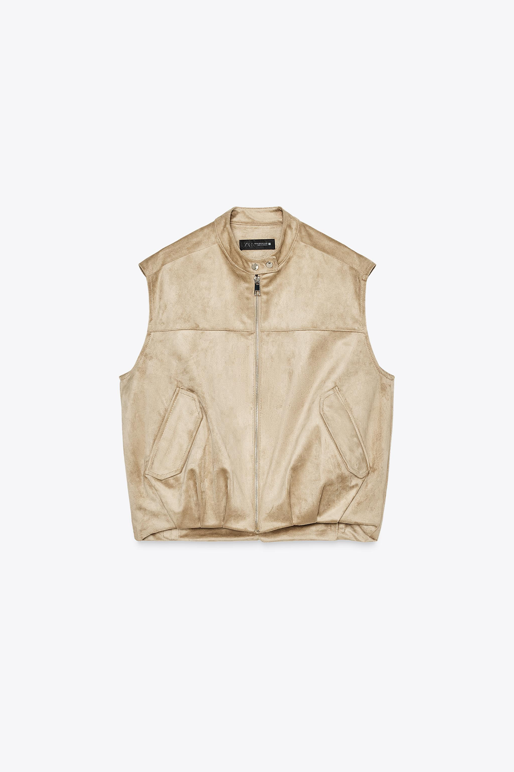 Round neck sleeveless gilet. Featuring front flap pockets and a pleated hem. Zip-up front. | Zara UK