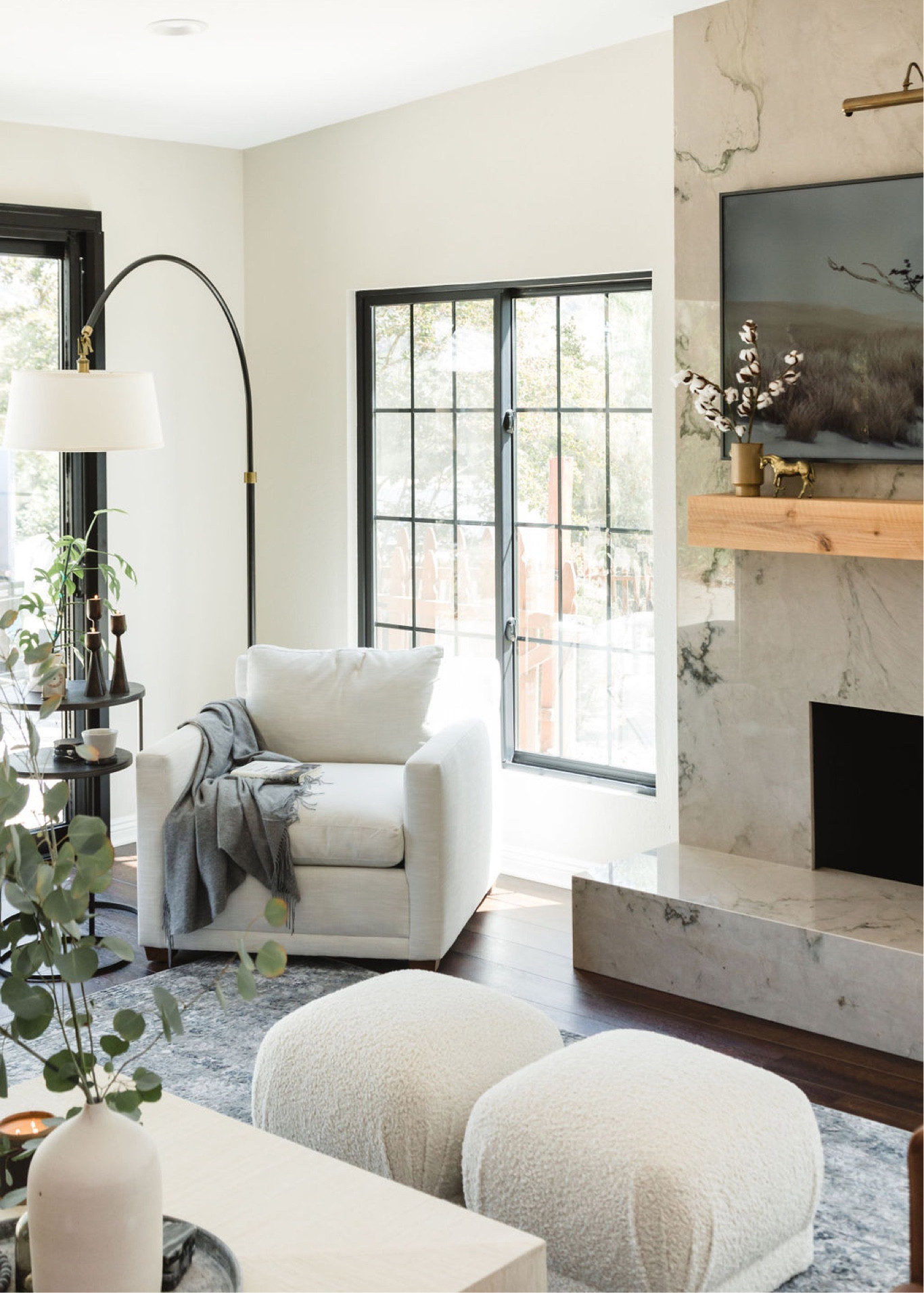 This stone slab covered fireplace with a gorgeous wood mantle sets the mood for this bright and beautiful living room. 

#livingroom #interiordesign #homedesign 


#LTKhome #LTKSeasonal #LTKunder100