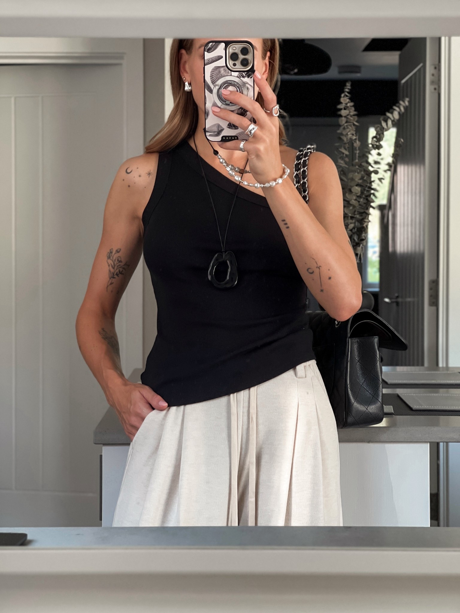 New vest top from Sezane - I love a good basic especially an asymmetric tank top: elevated but not over the top. An easy way to update your wide leg trousers or even joggers and loungewear chic (like I am wearing here) - I got a size S and I am a uk 10 on top (34 full inch bust 28D) 

**it’s a top that never fails me on date night too**

Sezane Tim Top - capsule wardrobe staple - Parisian chic 

#LTKautumn #LTKdatenight #LTKuk