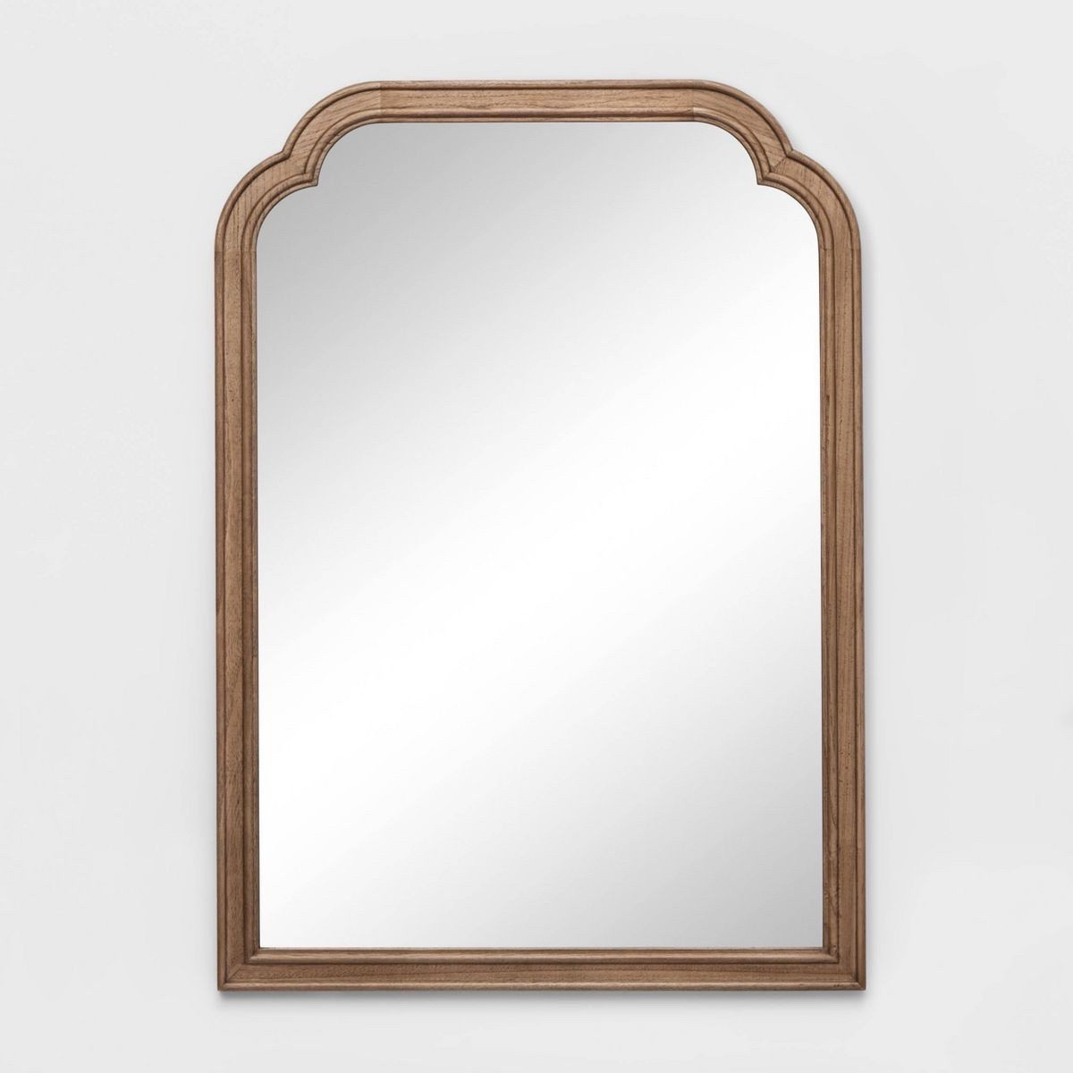 The Threshold™ French Country Wall Mirror combines style and function for any space. Set in a sturdy wooden frame with a natural finish, this mirror serves as a charming accent piece that effortlessly complements a variety of decor styles.

#LTKHome #LTKFindsUnder100 #LTKSaleAlert