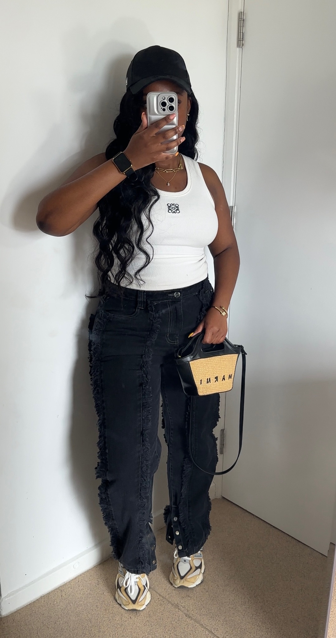 Summer Casual Outfit | 

White Loewe tank top and textured black straight leg jeans

#LTKSeasonal #LTKitbag #LTKstyletip