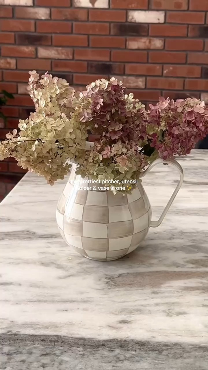 this pitcher doubles as a vase for flowers & a utensil holder - so pretty! 

Mackenzie Childs, pitcher, home decor, kitchen finds 