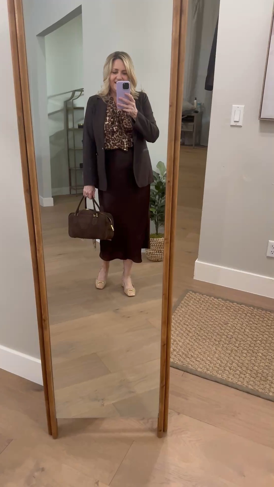 Chocolate brown midi skirt with animal print blouse
Work outfit, fall outfit 

#LTKMidsize #LTKSeasonal #LTKWorkwear