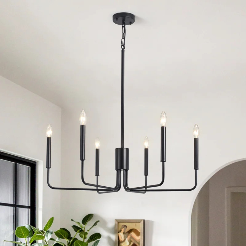 The modern farmhouse chandelier for the dining room is crafted from metal. It has a simple candle... | Wayfair North America