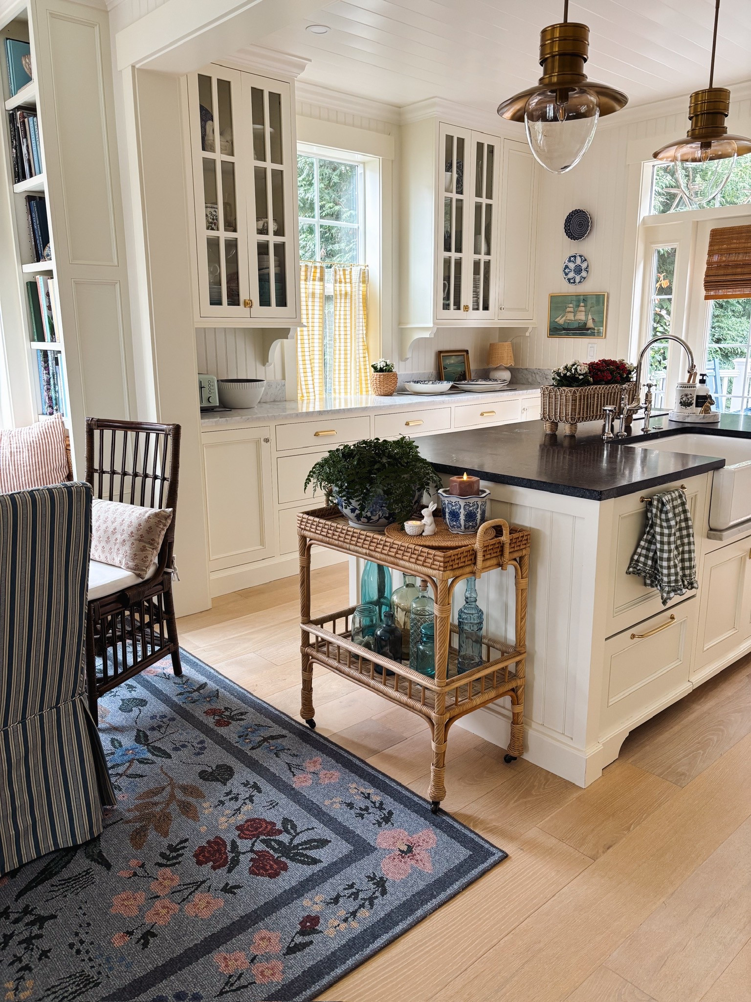 Cottage kitchen and dining room - forest green gingham ruffle tea towel, floral rug, cave curtain rod and rings, rattan cart, similar pendants, blue and white pots, rattan planter, sink and faucet and more #LTKStyleTip 

#LTKHome #LTKSeasonal