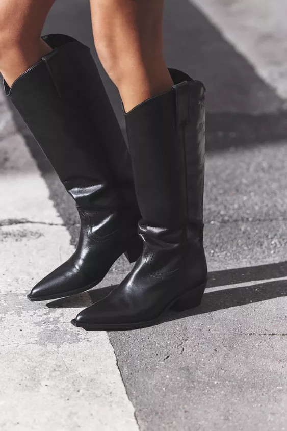 Knee high boots made of leather. Cowboy style. Side pull tabs. Pointed toe.Heel height: 2 inches ... | Zara US