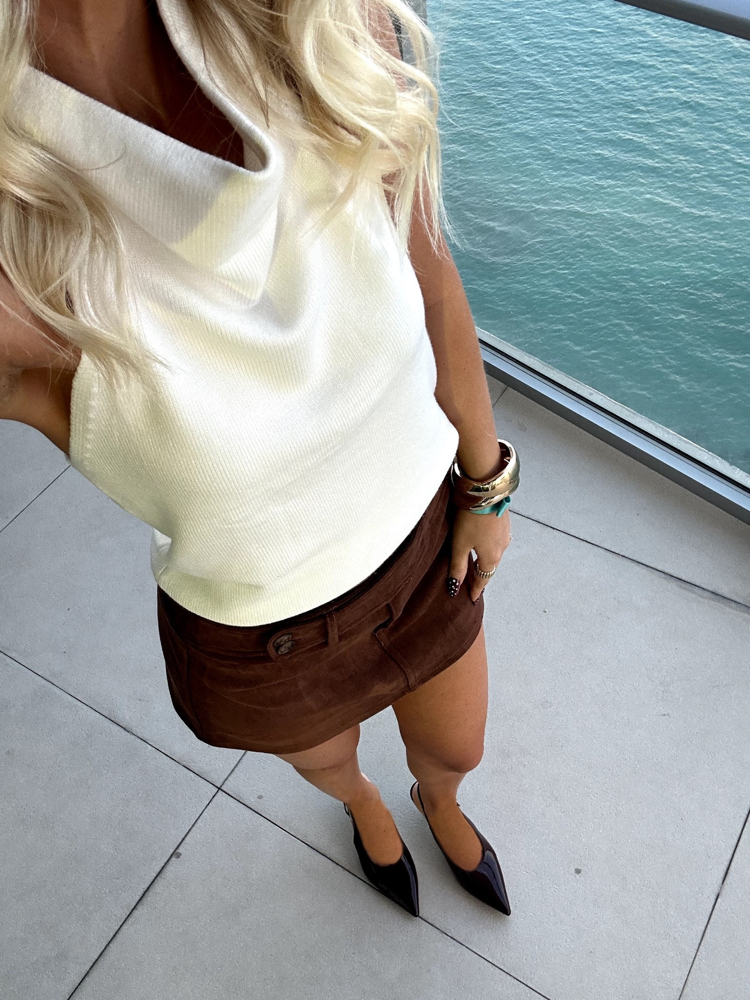 Adore this suede micro skirt & knit halter tank! Wearing size small in both. Kitten heels fit true to size. 

#LTKootd #LTKFindsUnder50 #LTKSeasonal