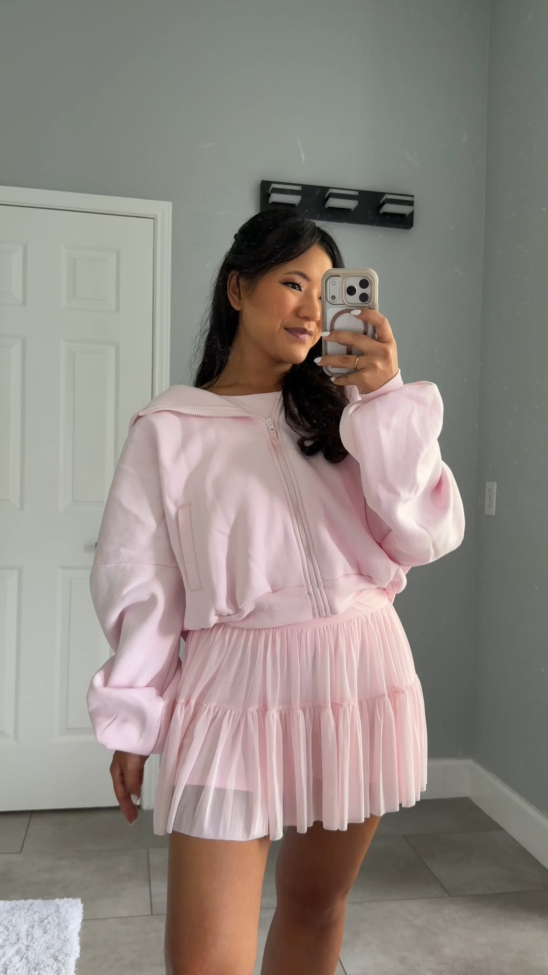 Blogilates Women's Ballerina Skort wearing size medium. Blogilates Women's Boatneck Crisscross Tank Top wearing size large. Blogilates Women's Marshmallow Full Zip Hooded Sweatshirt wearing size medium. 