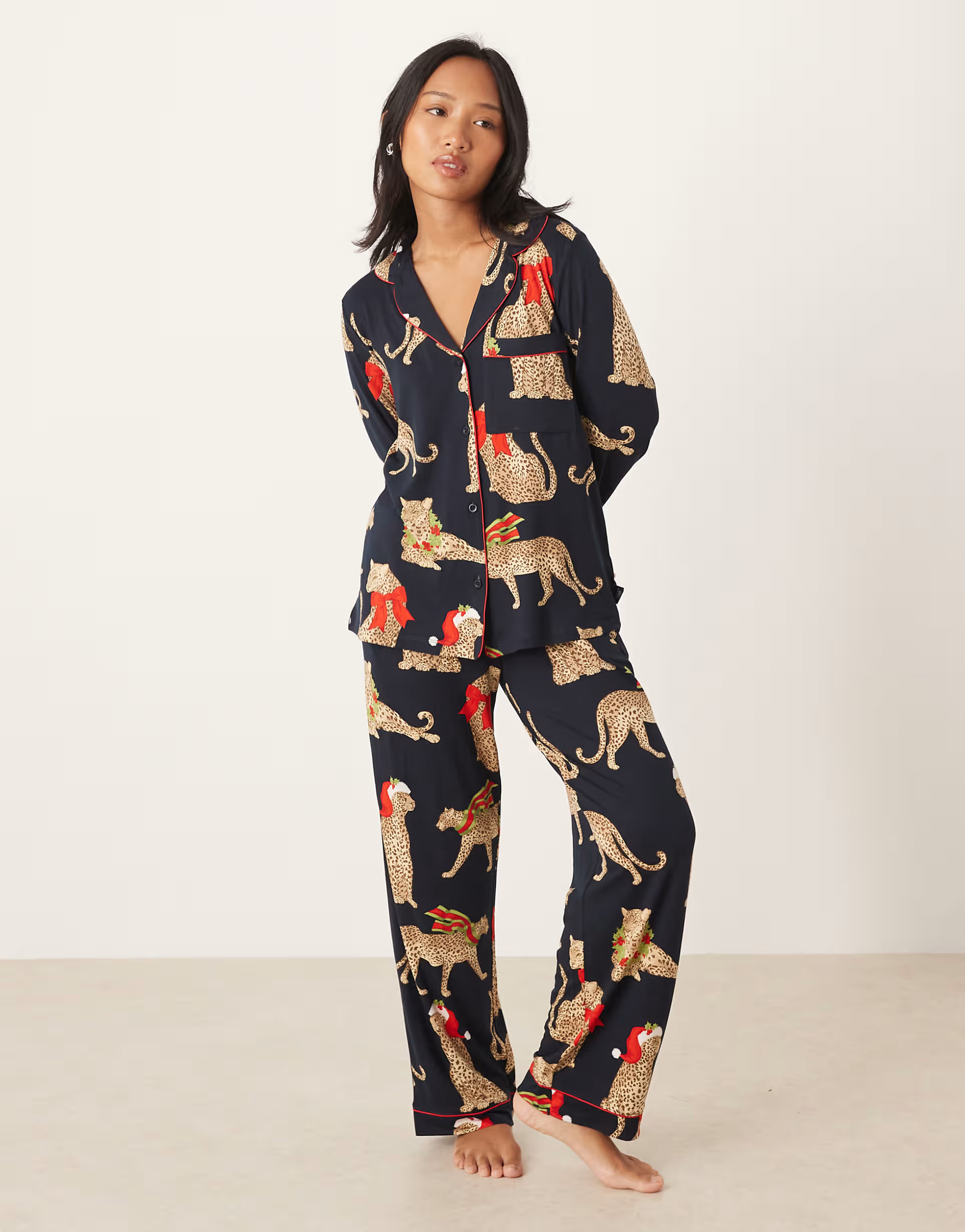 Chelsea Peers Petite poly long sleeve revere pyjama set in Christmas leopard print | ASOS (Global)