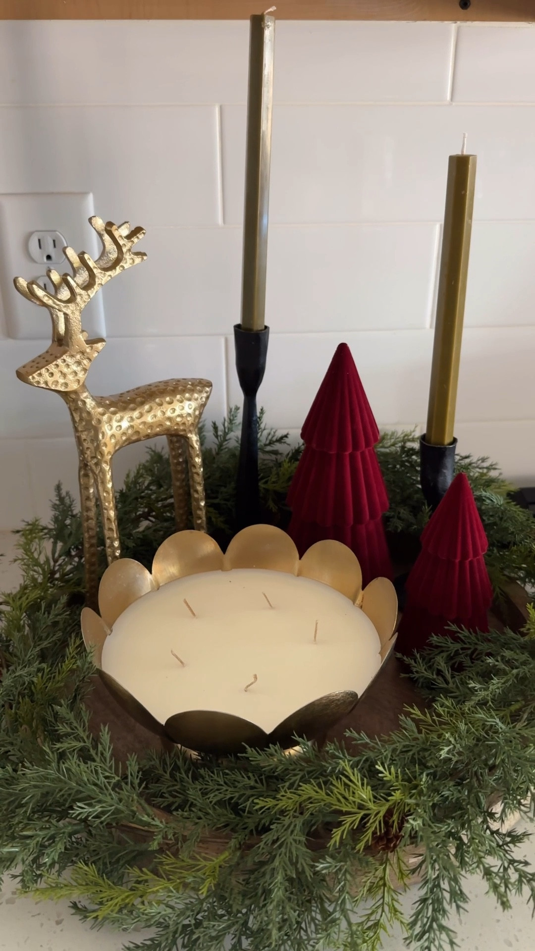 Easy and Simple Christmas Tray Styling. 
I repurposed my kitchen island tray to style a Christmas vingnette for my kitchen. 
I used a minimal 5ft garland to create a wreath look around the tray and then filled it with various affordable Christmas decor items I have gathered this year! I attempted to keep to the “triangle” styling method to help things feel balanced. 
This arrangement would work great for a kitchen island, coffee table, or dining table centerpiece! 


#LTKFindsUnder50 #LTKHoliday #LTKHome