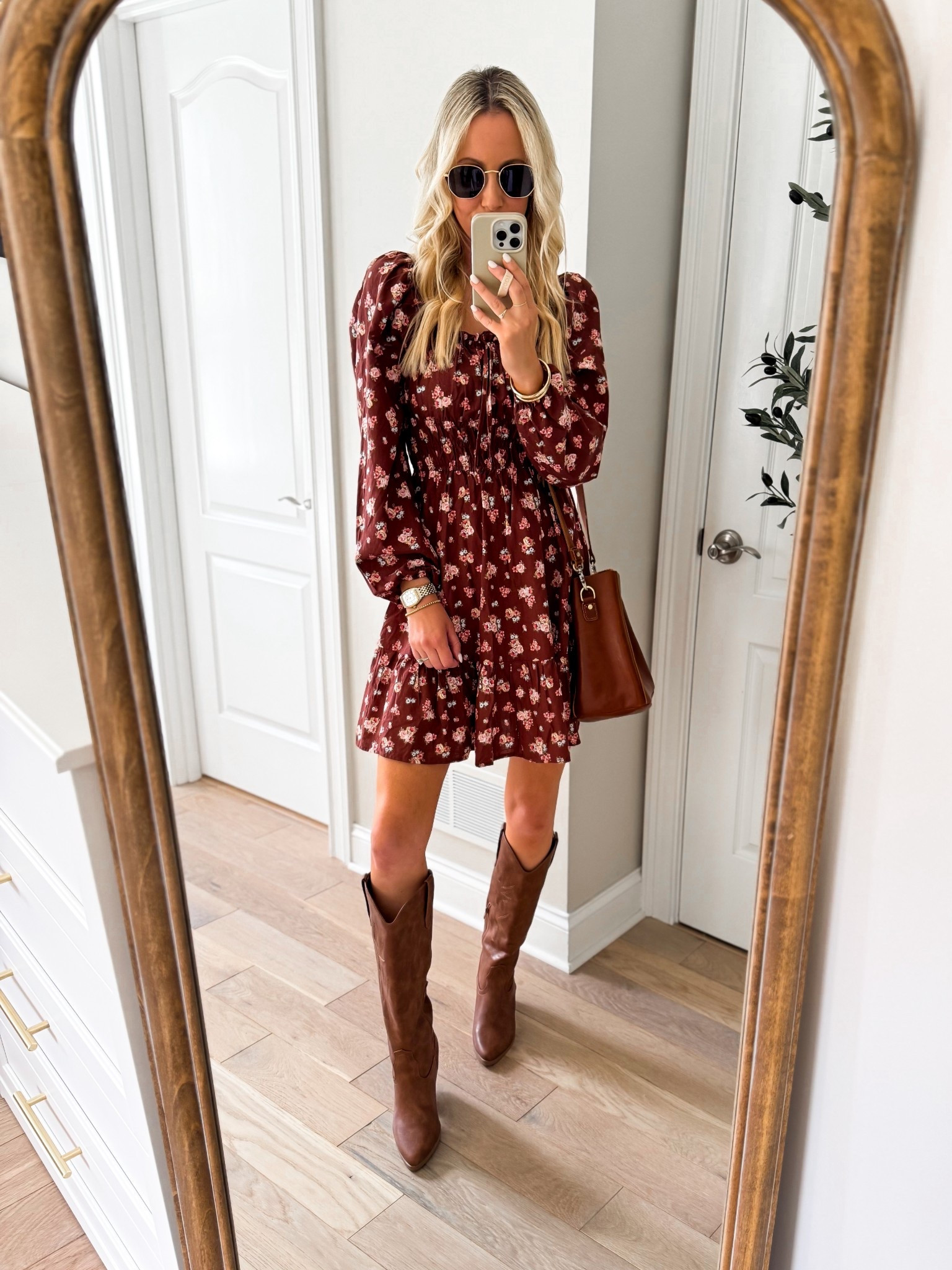 Fall outfit idea! How cute is this floral long sleeve mini dress? It’s technically a junior dress, but it fits like a woman’s dress! I had no idea it was juniors until I linked it! Love the tie front detail and the smocked waist! Also available in a navy floral, sizes XS-4X. So cute with western boots, but would love with flats, knee high boots, even sneakers! Pair with a denim jacket or cardigan when it gets chilly!  Love this mini dress for fall family photos, church, and teachers! I’m 5’7” wearing xs. 

#LTKWorkwear #LTKFindsUnder50 #LTKStyleTip