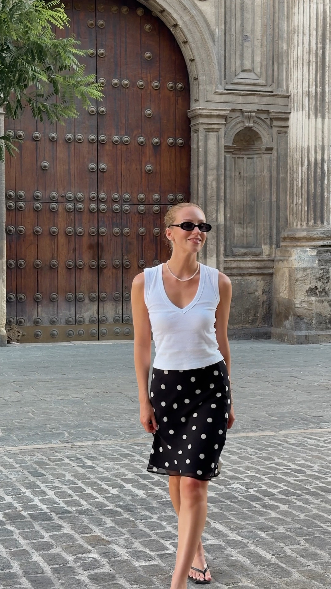 Polka dot skirt, summer outfit, summer evening outfit, flip flop heels, white v neck vest, le specs sunglasses, 90s outfit

#LTKuk #LTKsummer #LTKtravel