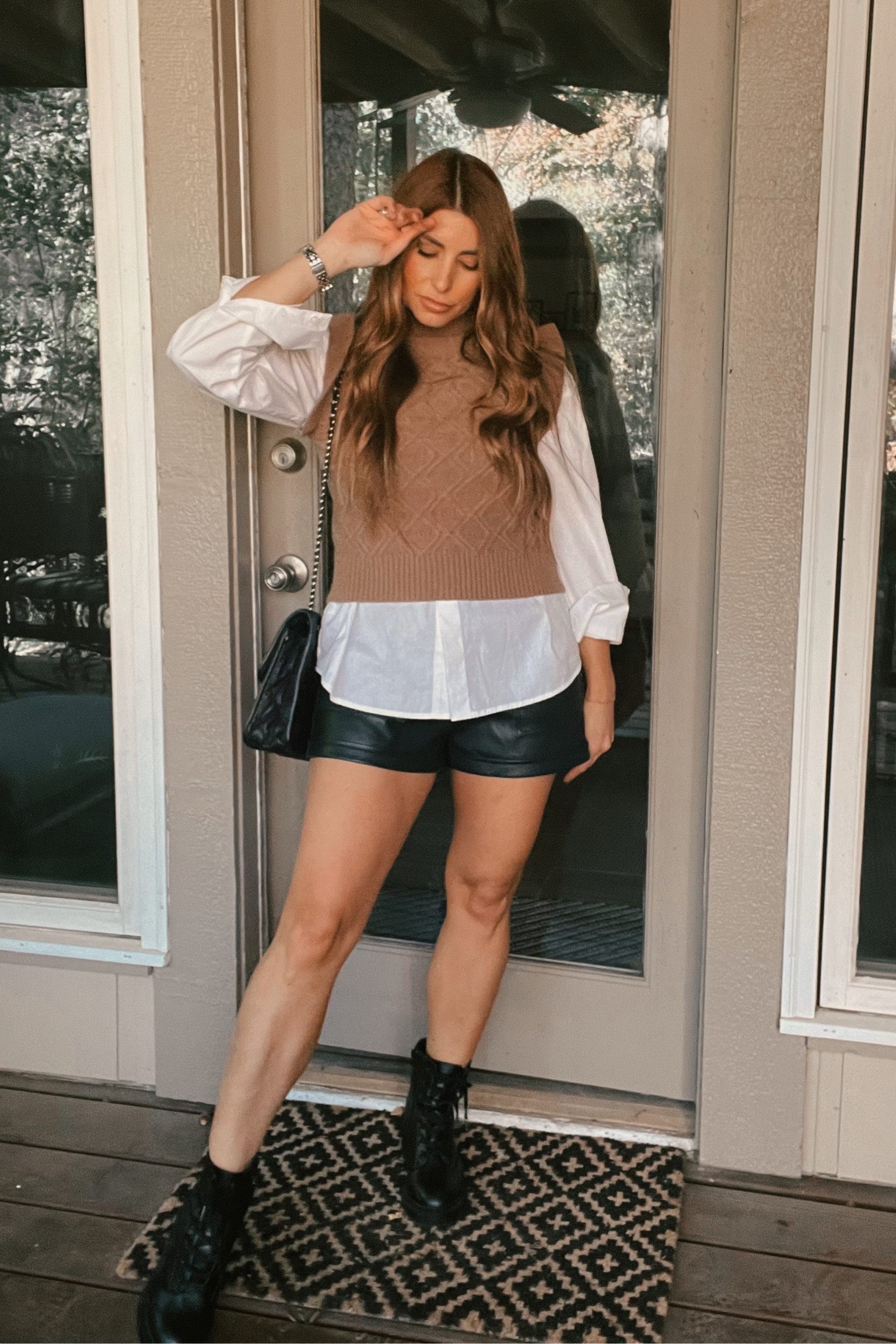 Sweater vest Amazon, faux leather shorts, combat boots  

#LTKstyletip #LTKSeasonal #LTKHoliday