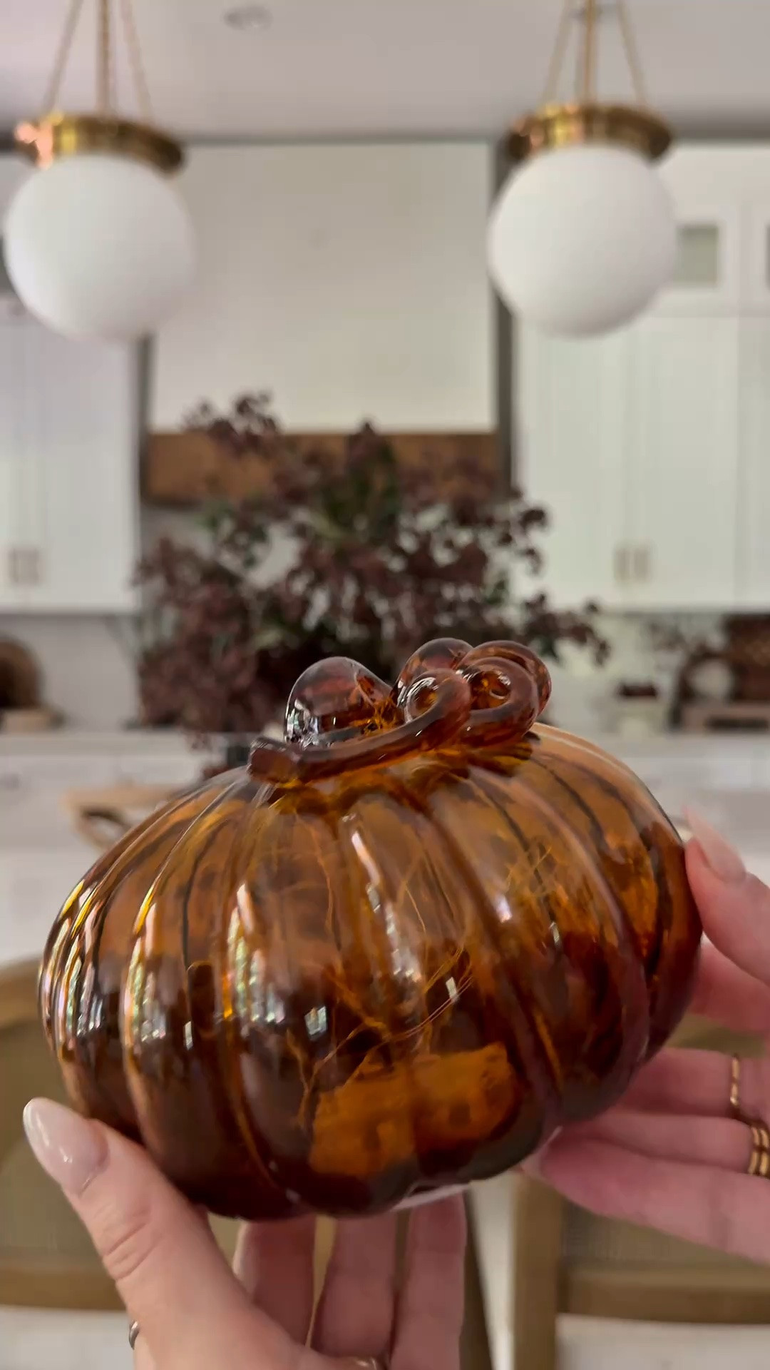 Brown glass pumpkins.. these have lights inside  to give off a cozy glow✨
Fall ready 
Autumn home decor 
Cozy kitchen