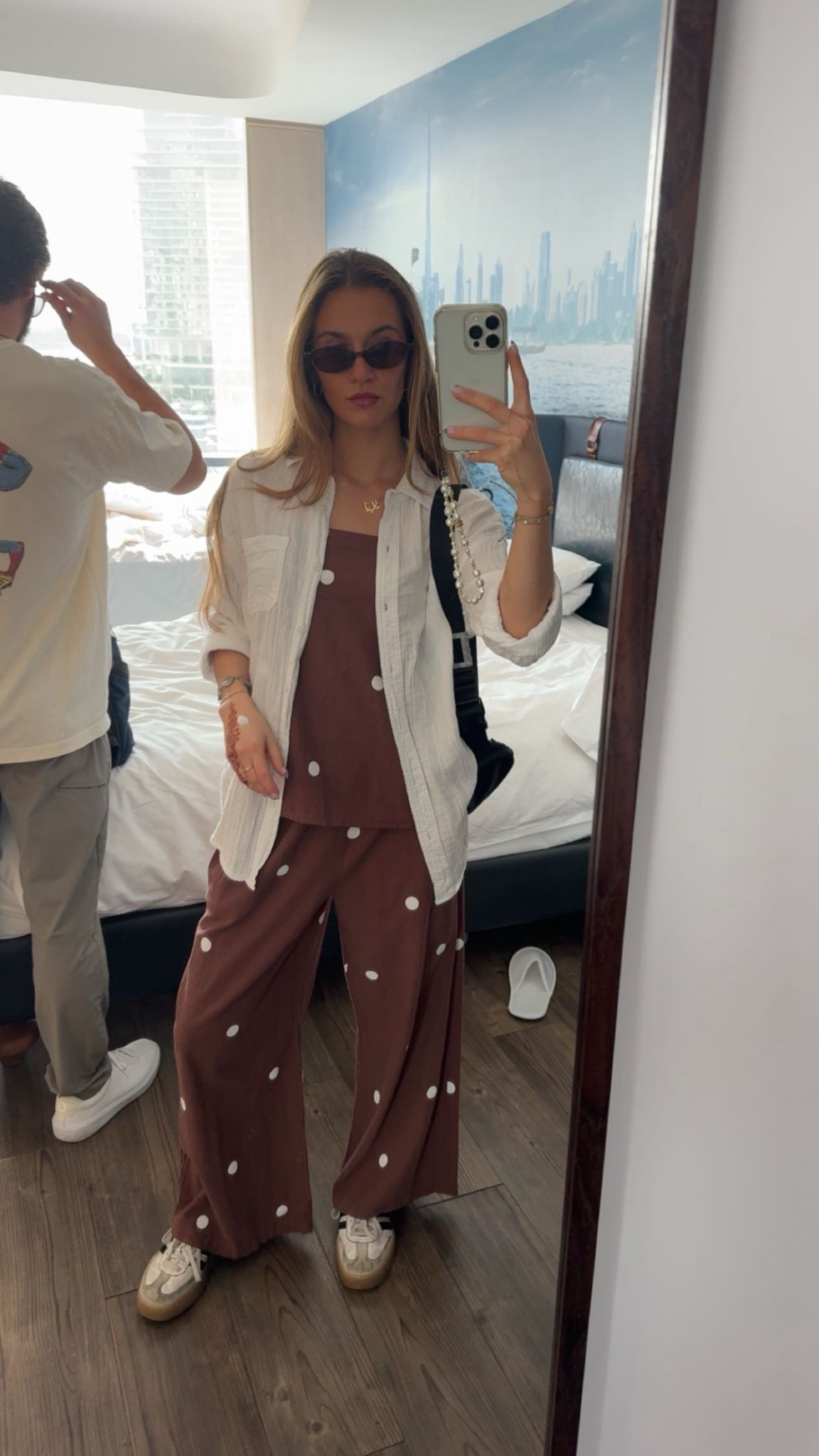 Comfortable travel outfit for city exploring! Here’s what I wore to explore Dubai! A fun matching set with a linen shirt for warmth. Big fun accessories and a mini sunnies☀️

#LTKstyletip #LTKSeasonal #LTKtravel