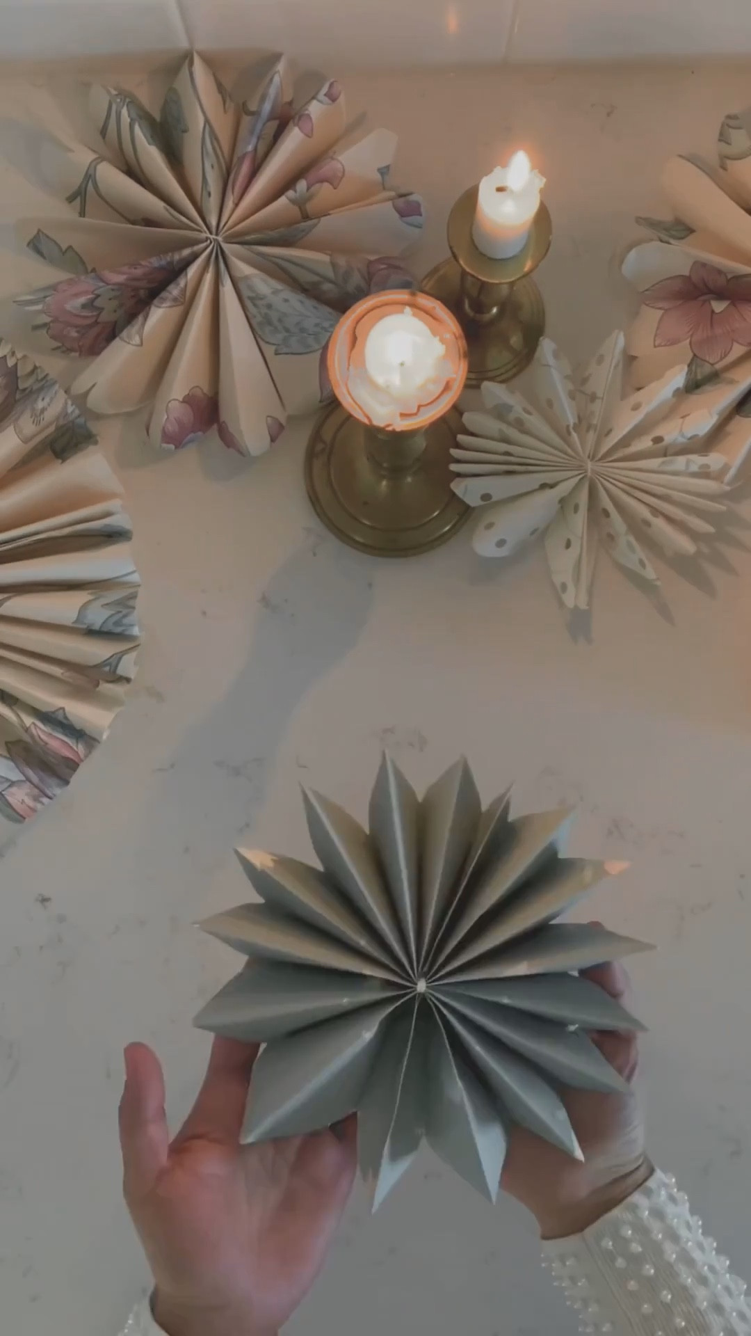 Easy DIY Christmas craft idea: paper stars made from leftover wrapping paper ✨ This simple holiday decor project is perfect for a cozy afternoon at home. Use any wrapping paper or scrapbook paper to make festive snowflakes or hanging ornaments. A budget-friendly, family-friendly Christmas DIY that adds handmade charm to your holiday decorations. 

#LTKHome #LTKSeasonal #LTKHoliday