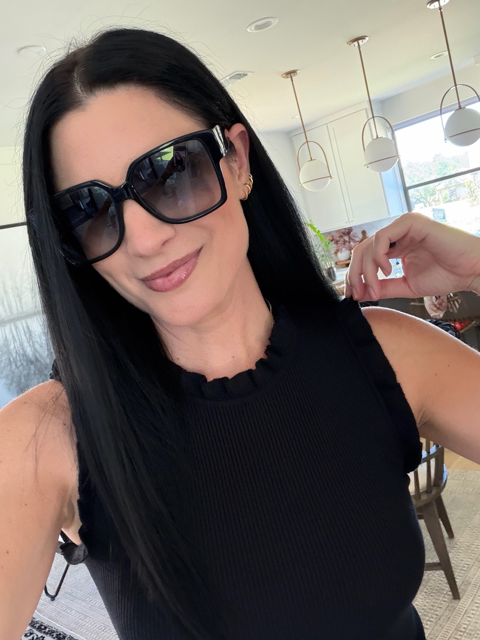 Amazon sale! My ruffle tank top is on sale for $17 from $22. I’m in the small. My black shorts are only $12 from $19! Also in the small. 

My sunglasses are only $190 from $495.

#LTKSaleAlert #LTKOver40