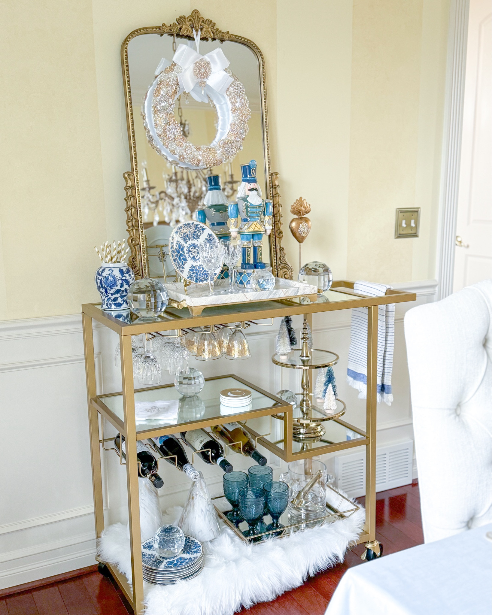 Shop my Christmas bar cart! 

Nutcracker figurine, Fitz and Floyd, brooch wreath, crystal sphere, sacred heart, gold tray, marble tray, tiered tray, wine glasses, blue glassware, blue and white decor, bar cart styling, bottle brush trees, cocktail napkins, gold mirror, glass trees, Christmas decor 

#LTKHoliday #LTKGiftGuide #LTKHome