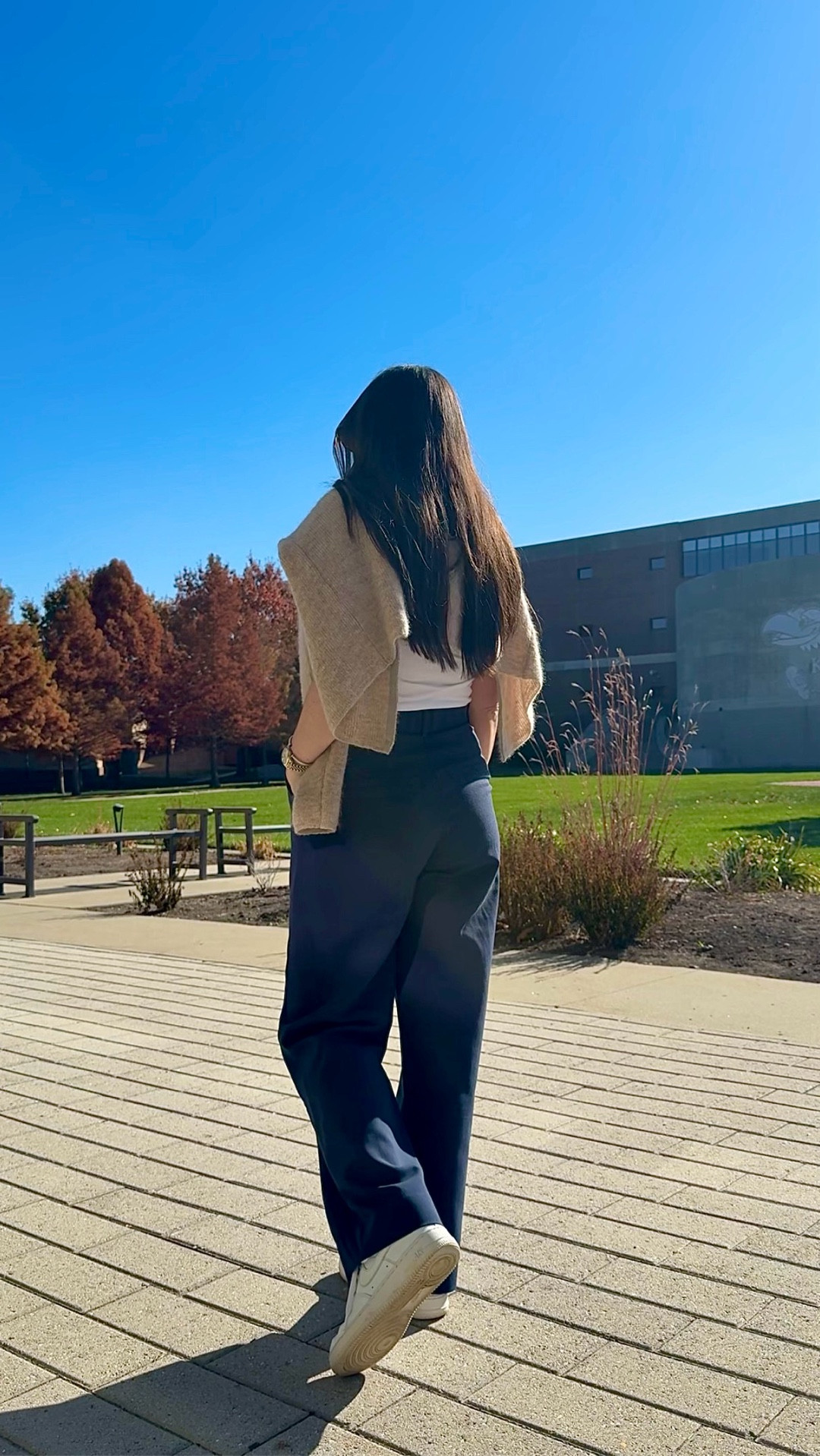 Abercrombie trousers paired with the perfect white tee, a cozy Sézane sweater, and classic Nike sneakers for an easy neutral everyday outfit. Added my favorite Prada sunglasses for a polished touch. This look is petite-friendly, comfy, and perfect for fall outfit inspo. Everything is linked for you here!

#LTKPetite #LTKWorkwear #LTKootd