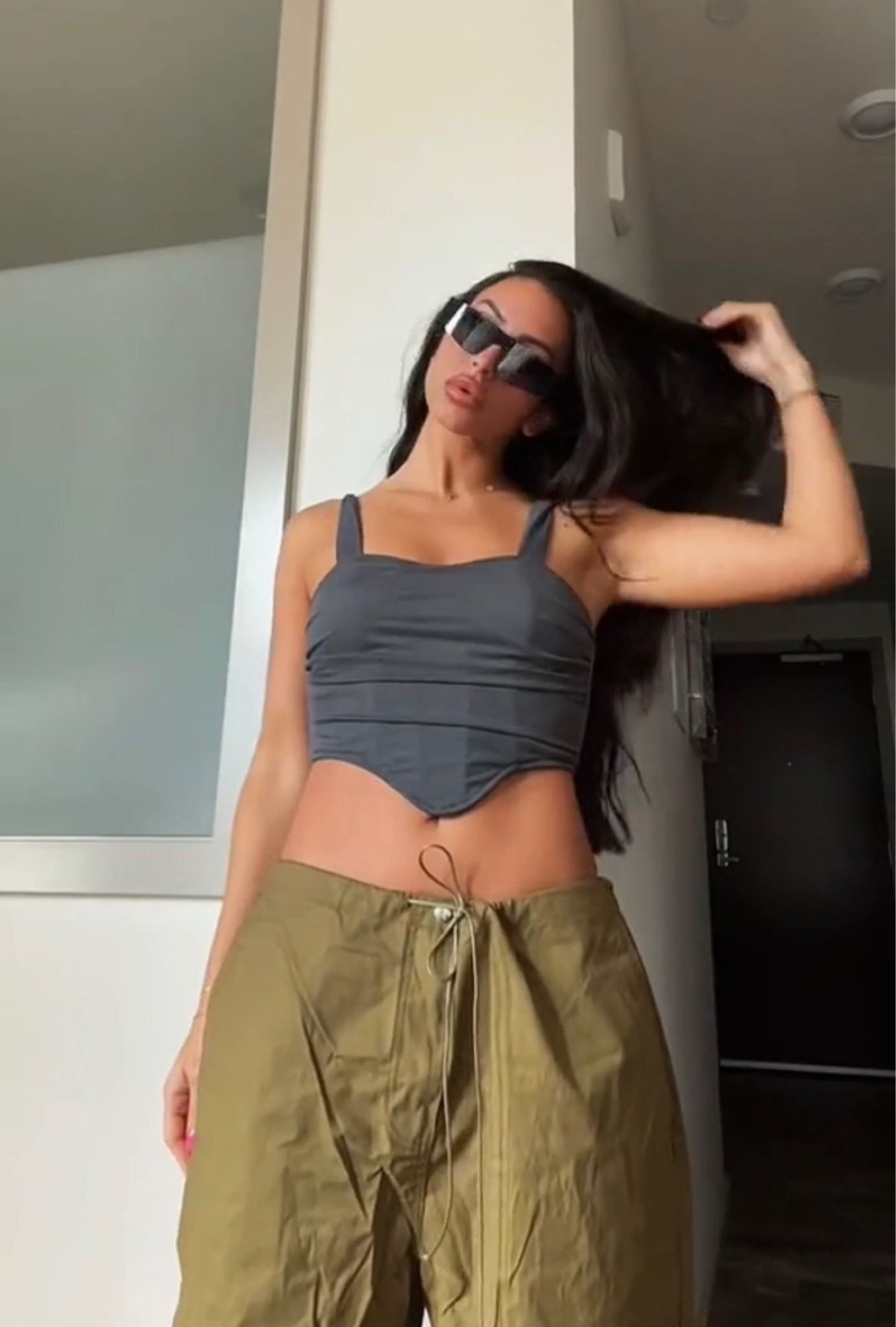This look is so cool I feel like I can wear this anywhere. Wearing the viral low waist baggy cargo pants again, which are going so viral for the fall, styled with this y2k top from Amazon and my new favorite sunglasses. I feel like an off duty celebrity in this fit 😎

Also, can we talk about this too being $12?! Amazon is too good to be true  

#LTKSeasonal #LTKstyletip #LTKsalealert