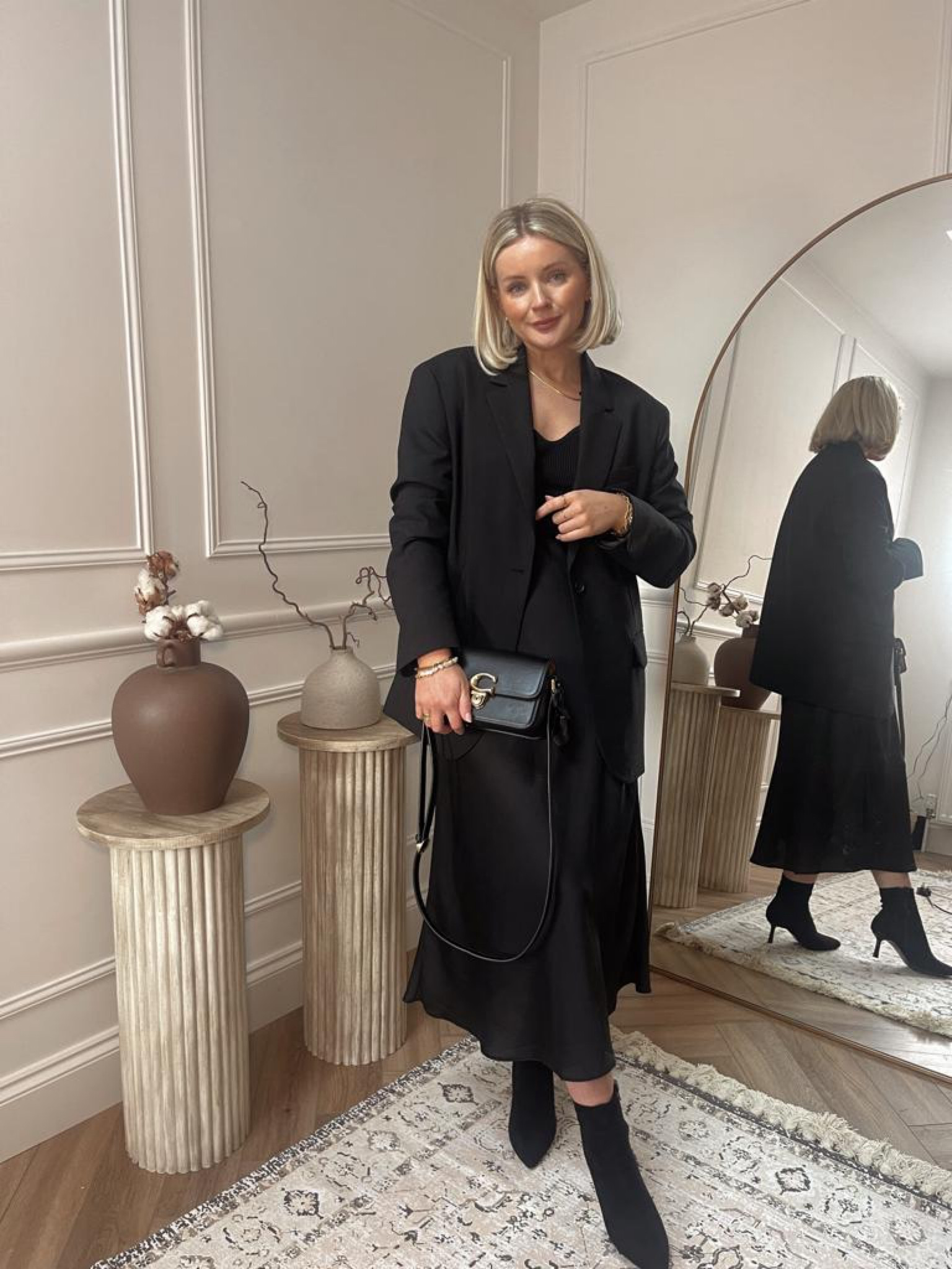 Ways to wear a black blazer - all black look for date night. Arket black wool blazer, H&M fitted long sleeve black top, black satin midi skirt, black heeled ankle boots, coach studio black handbag, monica vinader gold jewellery  

#LTKshoecrush #LTKstyletip #LTKitbag