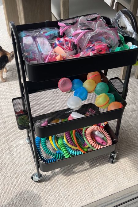 Metal 3 tier cart in wheels perfect for pool toys, art supplies, crafting materials or even food storage! 

#LTKfindsunder50 #LTKSeasonal #LTKhome