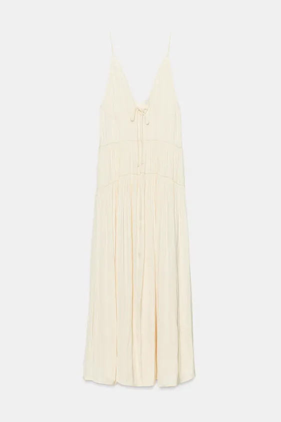 DescriptionCompositionMeasurementsModel height: 181 cmMid-waist mini skirt. Featuring bead appliq... | Zara UK