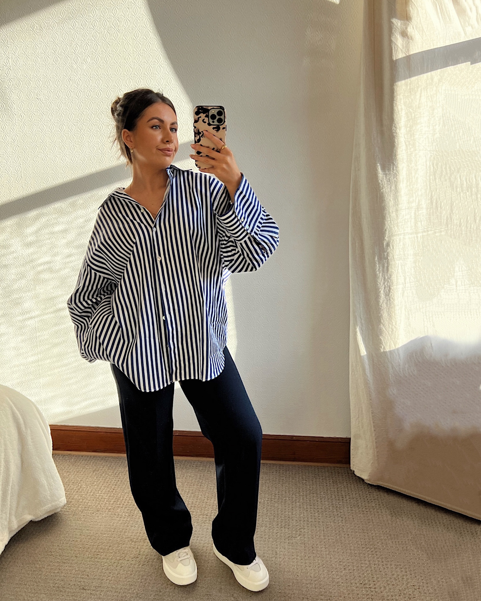 Oversized striped shirt and navy tailored trousers. Brunch outfit. Spring outfit. Work outfit. Staple capsule wardrobe. Outfit inspo. Shirt is H&M, trousers are Love and Roses, trainers are new balance Ct302.

#LTKstyletip #LTKshoecrush #LTKworkwear